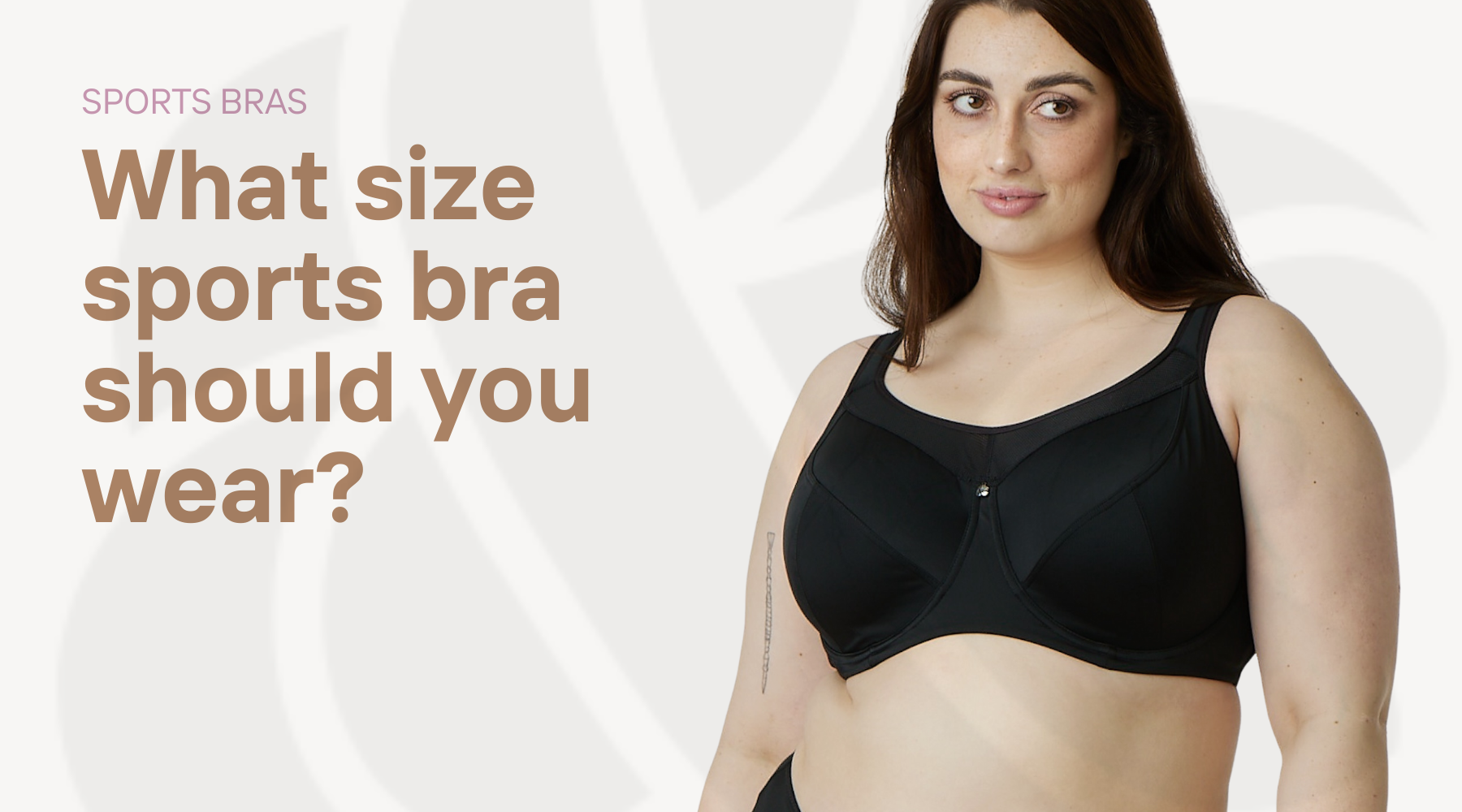 Plus size woman in black sports bra with text 'what size sports bra should you wear'